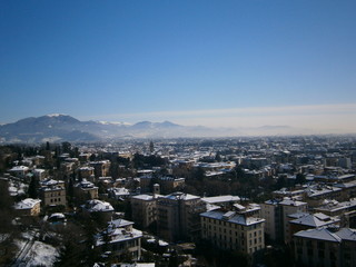 Fototapeta premium Winter Bergamo at the foot of the mountains