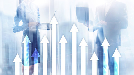 Up arrow graph on skyscraper background. Invesment and financial growth concept.