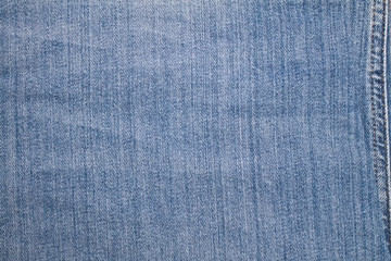 Texture of blue jeans textile close up
