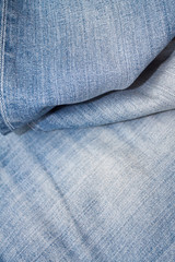 Texture of blue jeans textile close up