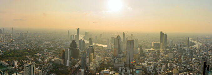 Fototapeta premium Panorama high view of the city with sunlight / High view of Bangkok city in sunset