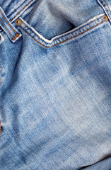 Fototapeta premium Texture of blue jeans textile close up