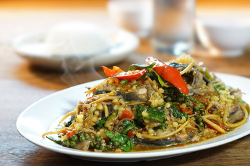 Thai tradition food: Pad Cha, Spicy Fried Catfish is Stired Hot&Spicy herb with cat fish and eggs. Served with steamed rice, Selective focus. Still life shoot in studio, Clean food good taste concept.