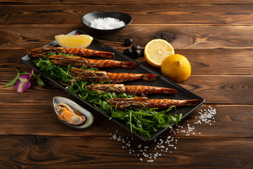 Argentinian grilled prawns on wooden background