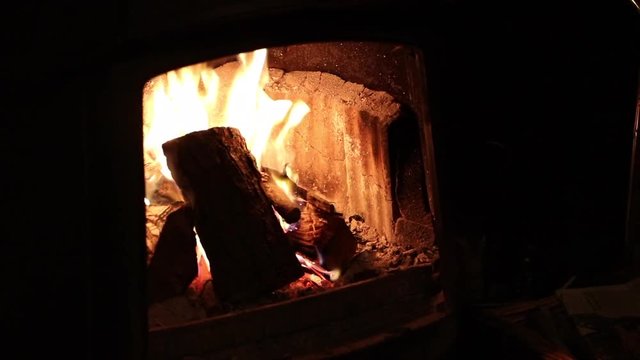 Roaring open log fire with flames.