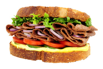 Steak and salad sandwich made with thin slices of reformed beef and pork meat isolated on a white background