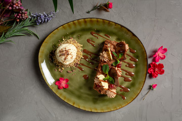 hazelnut brownie with chocolate petals and ice cream