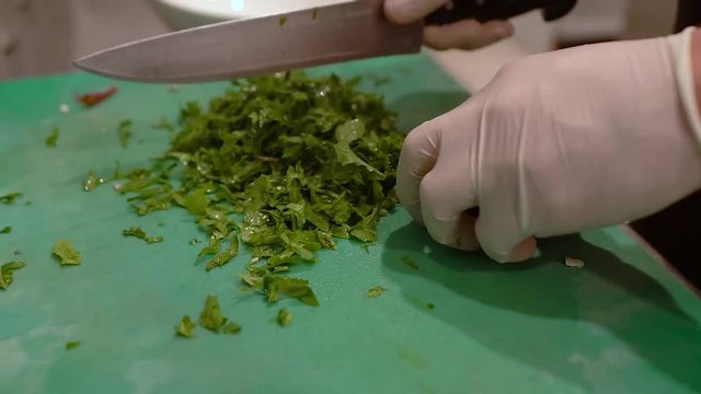 a chef slicing vegetables