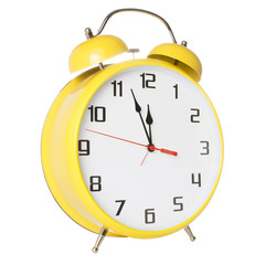 Yellow old style alarm clock isolated on white background