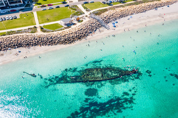 Aerial / drone photo over snorkelers at the Omeo shipwreck at Port Coogee, Fremantle, Western Australia.