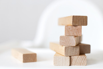 wooden pyramid on the highchair.  stick game.