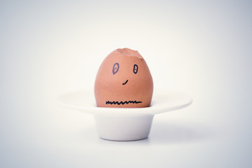egg on a stand in the form of human head . Concept. 