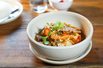 Pad Cha Tha Leh or Spicy Fried Seafood is Stired Hot&Spicy herb with fish, shrimp and squid. Served with steamed rice, Selective focus. Still life shoot in studio, Clean food good taste concept.