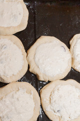 Preparation of round cheesecakes with cottage cheese and raisins