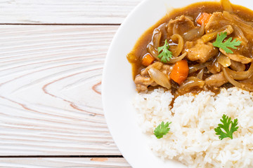 Japanese curry rice with sliced pork, carrot and onions