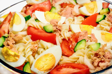 Traditional tuna salad isolated on white background. Selective focus.