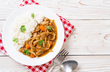 Japanese curry rice with sliced pork, carrot and onions