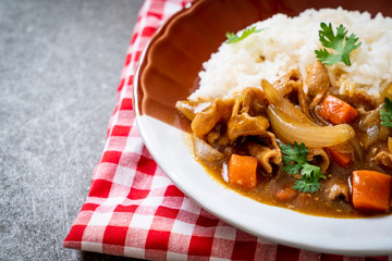 Japanese curry rice with sliced pork, carrot and onions