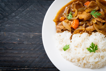 Japanese curry rice with sliced pork, carrot and onions