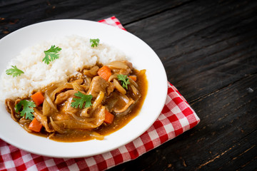 Japanese curry rice with sliced pork, carrot and onions