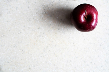 red apple on a black background