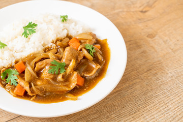 Japanese curry rice with sliced pork, carrot and onions