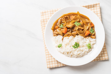 Japanese curry rice with sliced pork, carrot and onions