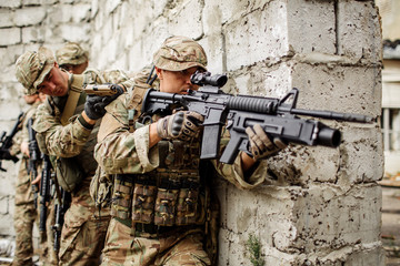 Army soldier during the military operation in the city. war, army, technology and people concept.