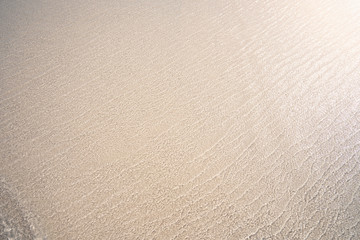 Beach and soft wave at the sea in summer holiday concept.