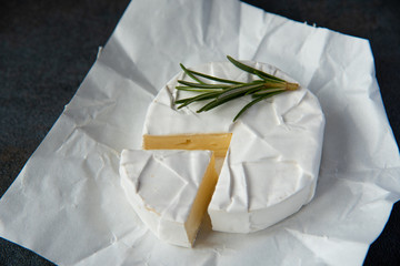 Cheese camembert or brie with fresh rosemary