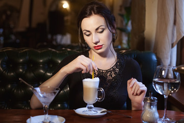 Sad woman drinks coffee and misses lonely in a cafe.
