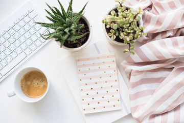 Minimalist ladys flat lay workplace decoration with coffee cup and keypad