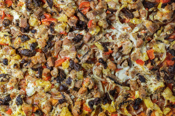 Food background - variety of pizza with pork, vegetables, olives and pineapple