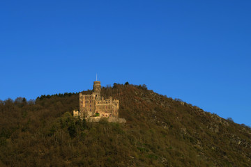 Fototapeta na wymiar German castle Burg Maus above the rhine and blue sky - Stockphoto