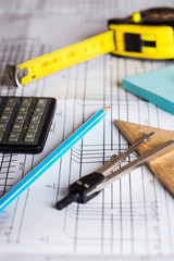 engineering and design. drawing and calculator, tape measure, ruler on the table