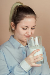 girl drinks milk and is happy