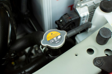 Obraz premium Radiator Cap of radiator cooling system, automotive part concept.