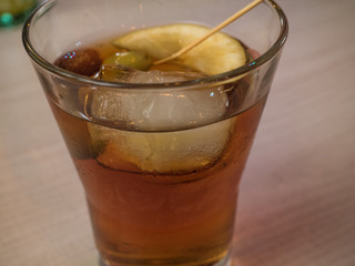 Red vermouth with olives in a glass