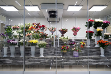 Flowers for sale in a special cold room with air conditioning. Refrigerator for flowers