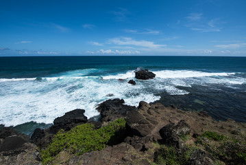 Ocean waves crashing on rocky beach