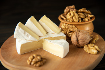 Cheese camembert or brie with walnut kernels