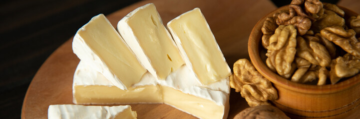 Cheese camembert or brie with walnut kernels