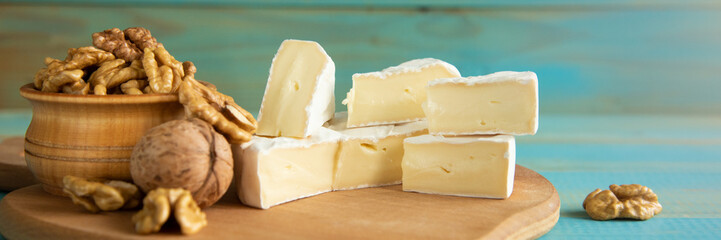 Cheese camembert or brie with walnut kernels