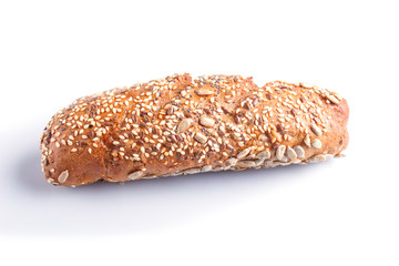 Rye bread with sunflower seeds, sesame and flax isolated on white.