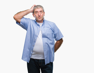 Handsome senior man over isolated background confuse and wonder about question. Uncertain with doubt, thinking with hand on head. Pensive concept.