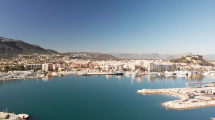 Fototapeta na wymiar Aerial view of Denia port. The city and Montgo mountain in the background.