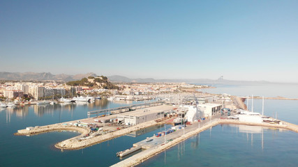 Fototapeta na wymiar Aerial view of Denia port. The city and the Denia castle in the background.