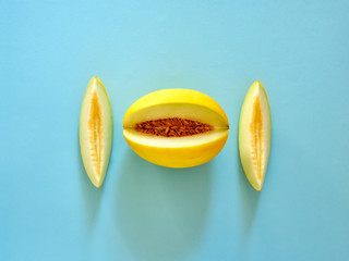Yellow Melon Fruit isolated in cyan background viewed from above - flatlay look - Image