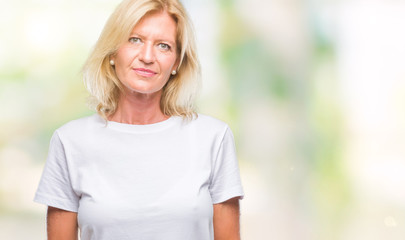Obraz premium Middle age blonde woman over isolated background with serious expression on face. Simple and natural looking at the camera.