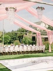 Table setting at a luxury wedding reception. Outdoor wedding
